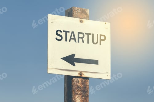 Preview: Startup Word And Arrow Signpost On Clear Sky Background. Motivational Sign. Vintage Style.