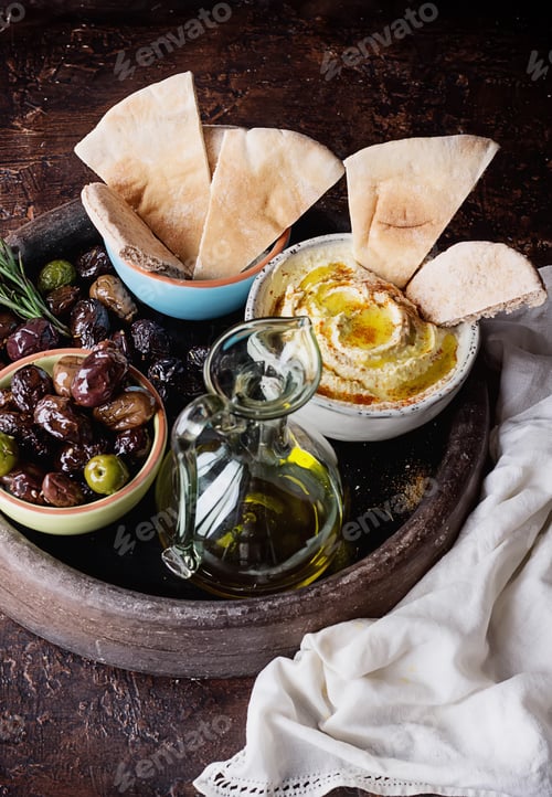 Preview: Traditional Middle East Appetizer Hummus Served With Fresh Pita Bread, Olives, Herbs, Seasoned With