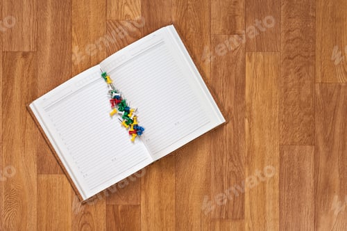 Preview: Blank Notepad With Office Supplies On Wooden Table. Above View.