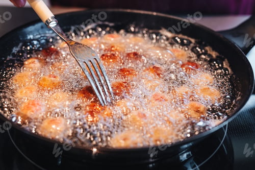 Preview: Frying Home Made Italian Traditional Meatballs With Parmesan And Bread