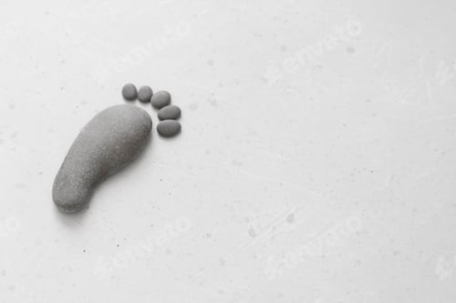 Preview: Footprints Made Of Stones. Happy Feet. Stone Arranged Like Footprints On The Beach. Spa Background