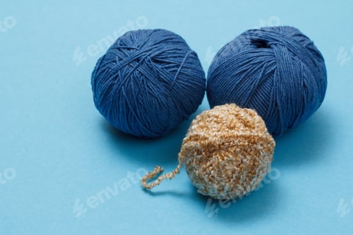 Preview: Knitting Yarn Balls On A Blue Background. Knitting Concept. Top View.