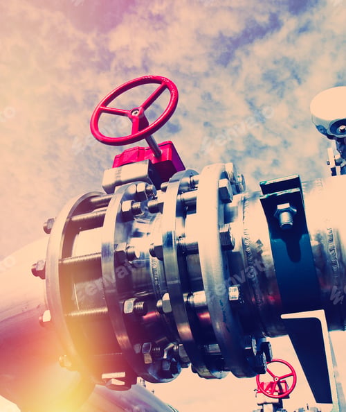 Preview: Industrial Zone, Steel Pipelines And Valves Against Blue Sky