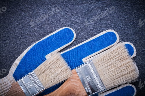 Preview: Paintbrushes Protective Gloves On Black Surface Construction Concept.
