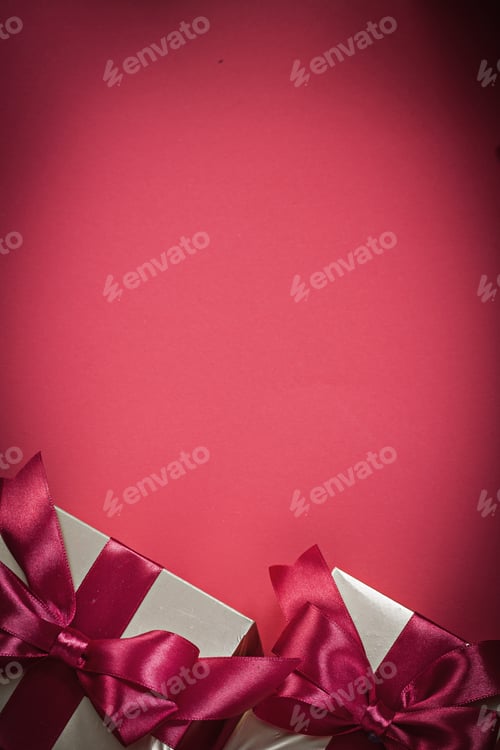 Preview: Packed Present Boxes On Red Background Top View Holidays Concept.