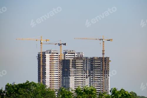 Preview: Cranes Developing The Building On A Sunny Summer Day
