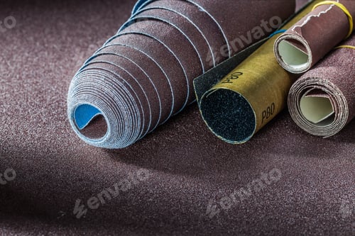 Preview: Set Of Rolls Sand Paper On Abrasive Background