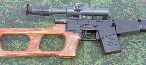 Preview: Modern Russian Sniper Rifle With Optic Scope On Camouflaged Uniform Background