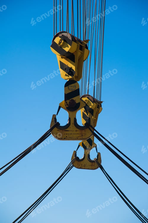 Preview: Loading In Port. Floating Port Crane On Blue Sky Background. Chains And Hooks Hoist With Slings For