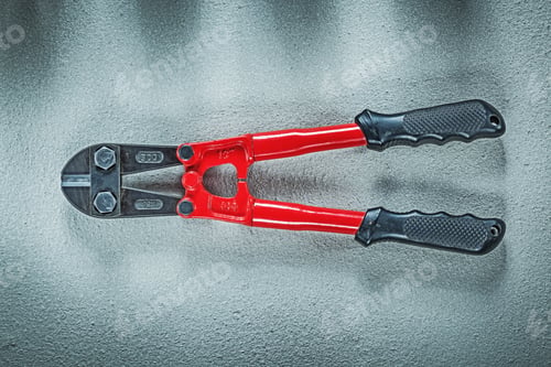 Preview: Bolt Cutter On Concrete Surface Construction Concept.