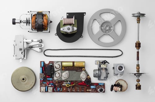 Preview: Parts Of A Vintage Film Projector Well Arranged Over White Background, Above View. This Is Part Of