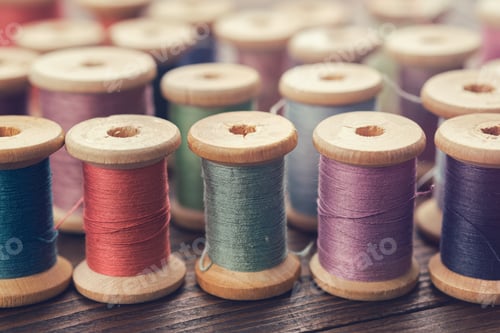 Preview: Various Vintage Wooden Spools Of Multicolored Threads.
