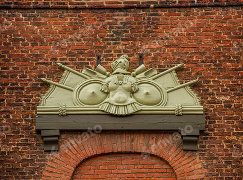 Preview: Military Door Ornaments Surrounded By Brick Walls.