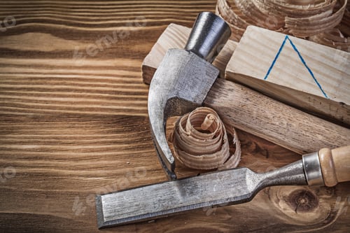 Preview: Claw Hammer Firmer Chisel Wooden Studs Shavings On Vintage Wood Board.