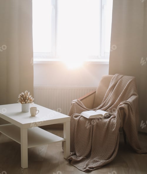 Preview: Cozy Interior With Coffee Table, Armchair And Plaid Near Window. Sunny Cozy Living Room