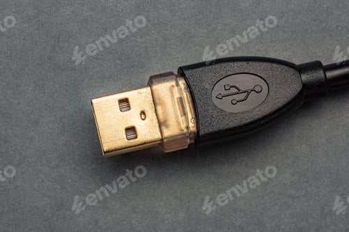 Preview: Gold Usb-Plug On Grey Background