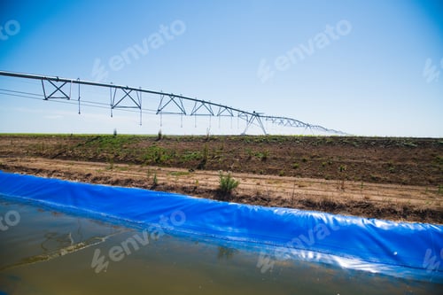Preview: Automated Farming Irrigation Sprinklers System On Cultivated Agricultural Landscape Field