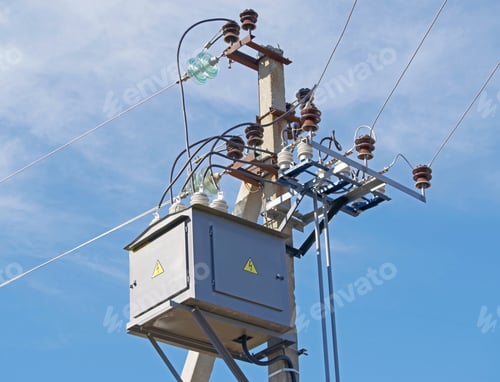 Preview: Electric Tower High Voltage And High Voltage Transformer Against The Sky