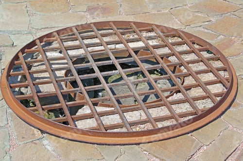 Preview: Rusty Drain Hatch Covered With Grid