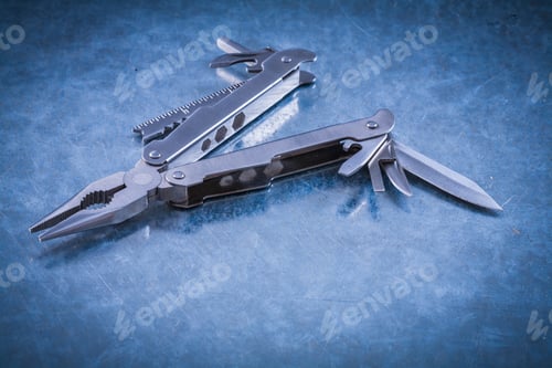 Preview: Multipurpose Steel Clasp-Knife On Scratched Metallic Surface.