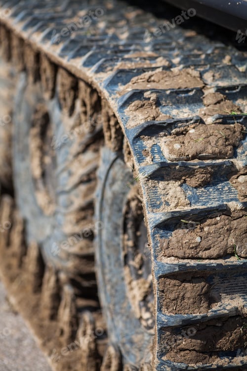Preview: Close Up Of A Caterpillar Track Full Of Mud.