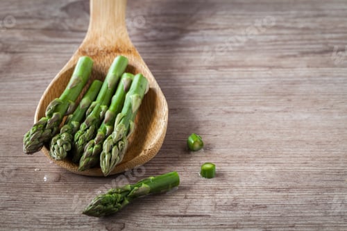 Preview: Fresh Raw Asparagus On Wooden Spoon