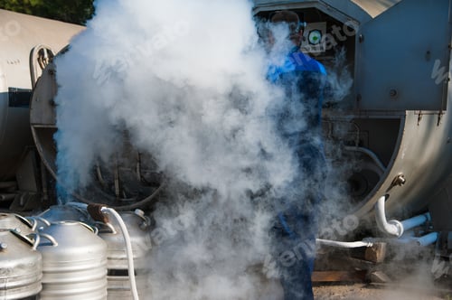 Preview: Young Engineer Fill With Liquid Nitrogen With Nitrogen Storage Tank At New Factory