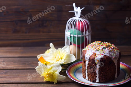 Preview: Colorful Easter Cake, Easter Eggs And Flowers On Dark Wooden Background. Easter Background