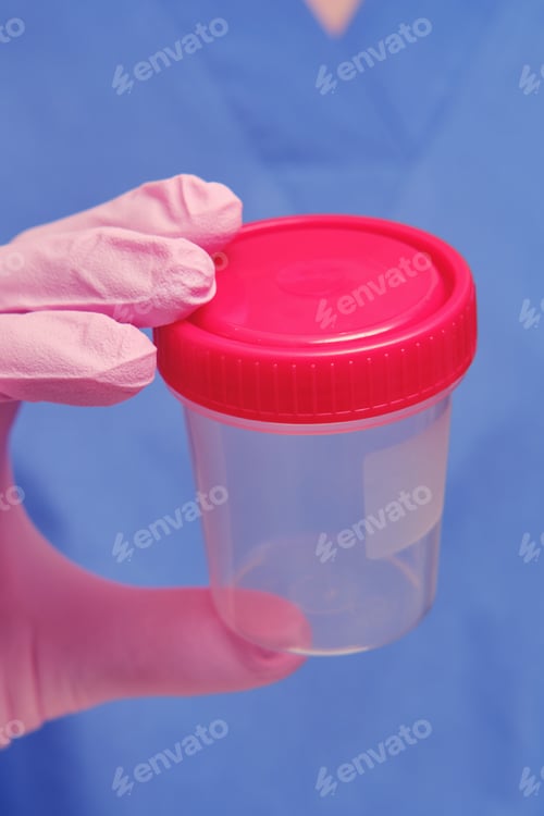 Preview: Hand In A Protective Glove With A Jar For Testing For The Flu Virus. The Doctor'S Hand Holds A