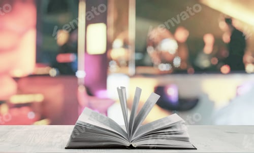 Preview: Open Book On White Table In A Night Club
