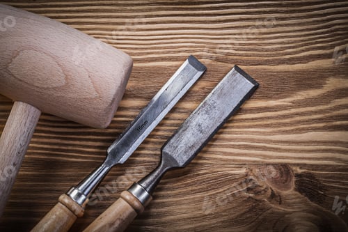 Preview: Lump Hammer Flat Chisels On Vintage Wood Board Construction Concept.