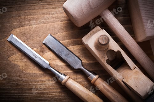 Preview: Wooden Hammers Planner Flat Chisels On Wood Background Construction Concept.
