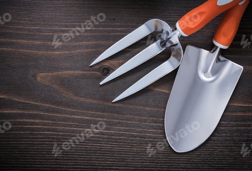 Preview: Trowel Gardening Fork And Hand Shovel On Vintage Wooden Board Agriculture Concept.