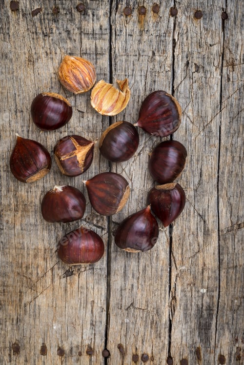 Preview: Fresh Raw Chestnuts On A Wooden Background