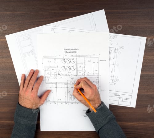 Preview: Mans Hands Drawing Drafts On Wooden Table