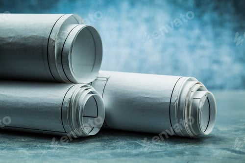 Preview: Three Rolls Of Blueprints On Metalic Background