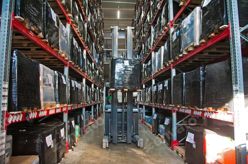 Preview: Interior Of Warehouse. Rows Of Shelves With Boxes. Forklift Loader Worker Driver At Warehouse
