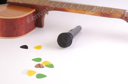Preview: Guitar And Microphone On A White Background