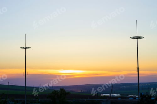 Preview: The Silhouettes Of Lightning Rods At Sunset, Protecting The City From Lightning Strikes