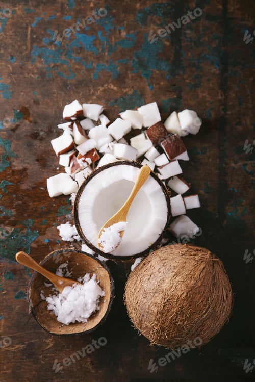 Preview: Organic Coconut Oil Served With Coconuts, Shells And Bits Of Coconut Decorated With A Sppon Over A