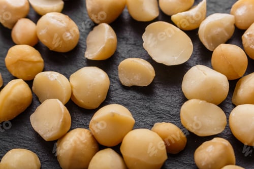 Preview: Delicious Macadamia Nuts On A Dark Stone Background