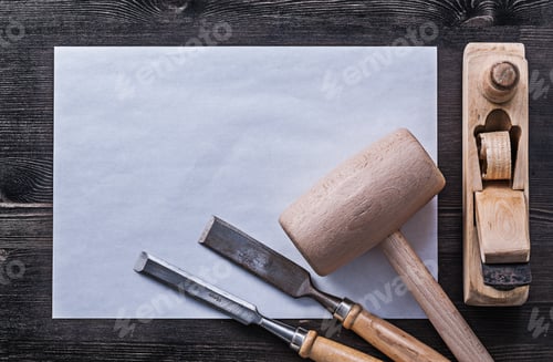 Preview: Flat Chisels Wooden Hammer Planer Sheet Of Paper Construction Concept.