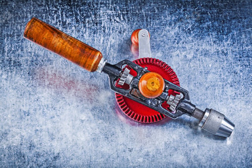 Preview: Vintage Portable Drill On Metallic Background.