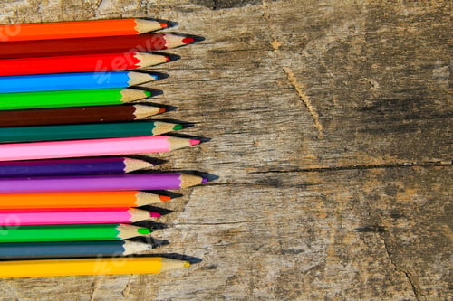Preview: Colored Pencils On Old Wooden Background