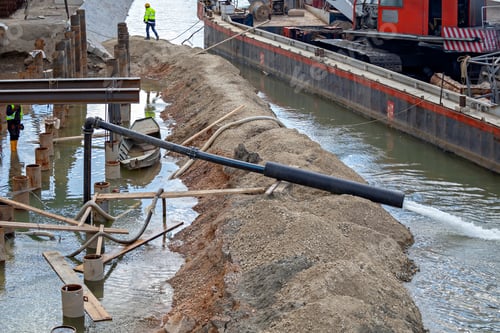 Preview: Pump High Pressure Working At River Bank. Stream Of Water From The Water Pump Pipe. Flood