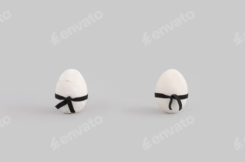 Preview: Creative Easter Layout With Two White Eggs Wearing Black Karate Belt