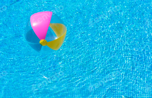 Preview: Summer Holiday Background, Inflatable Beach Ball Floating On Refreshing Blue Swimming Pool Water.