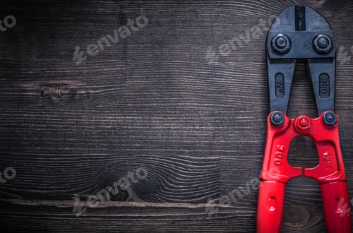 Preview: Metal Steel Cutter On Wooden Board Copyspace Construction Concept.