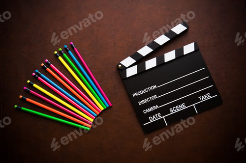 Preview: Wooden Writer Desktop With Colorful Pencil And Black Movie Clapper Board