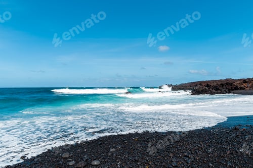 Preview: Beautiful Beach On The Island Of Lanzarote. Sandy Beach Surrounded By Volcanic Mountains / Atlantic